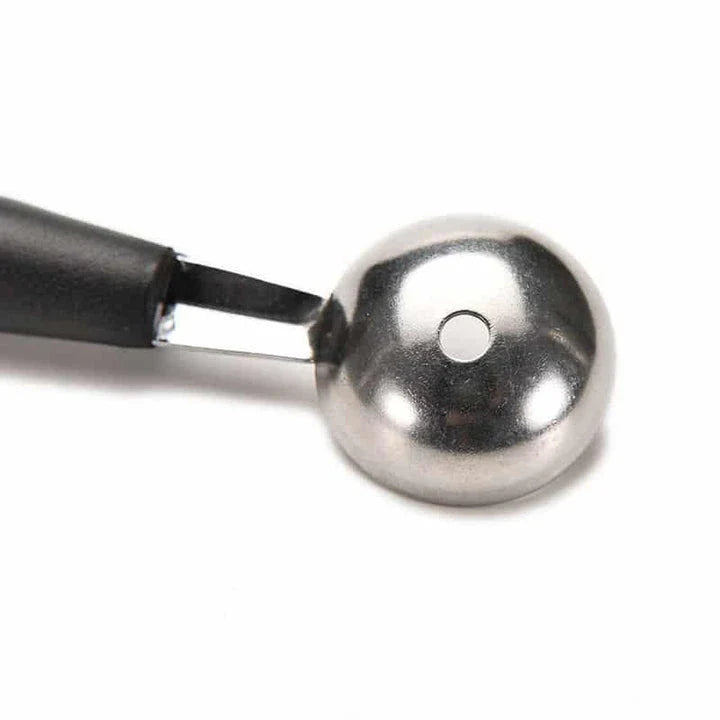 A premium double-ended stainless steel fruit carving scoop for creating intricate, Instagram-worthy culinary displays