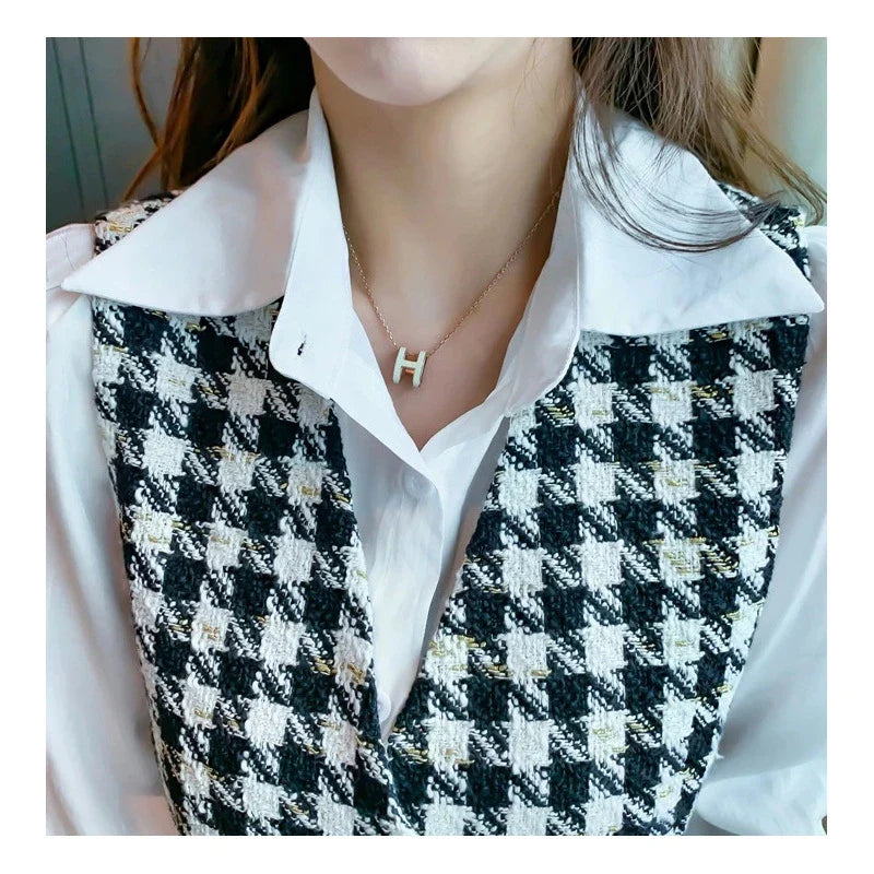 Lightly Cooked Temperament Yujie Fried Street Small Incense Wind Vest Two-Piece Suit in a check pattern, featuring a high-waisted skirt and a vest top