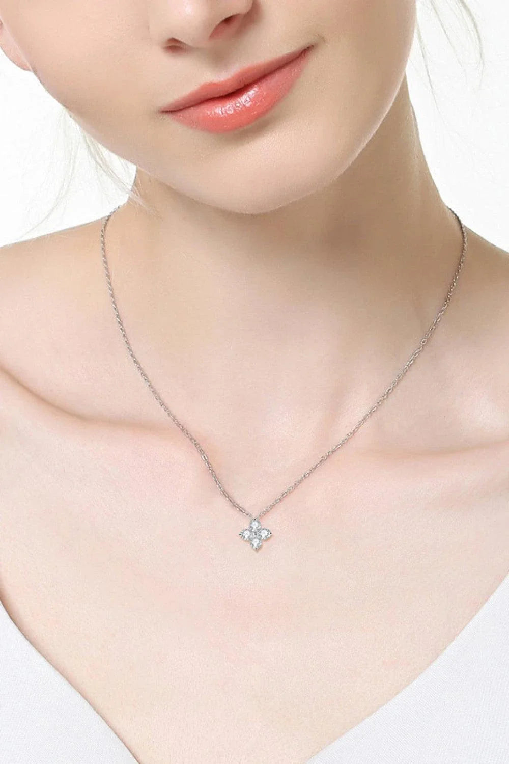 Moissanite four-leaf clover pendant necklace in sterling silver, a modern and elegant accessory with a touch of luck and charm.