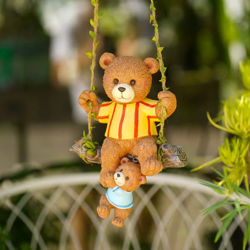 Charming resin ornament depicting a mother bear and her child on a swing, adding a touch of whimsy and warmth to any decor