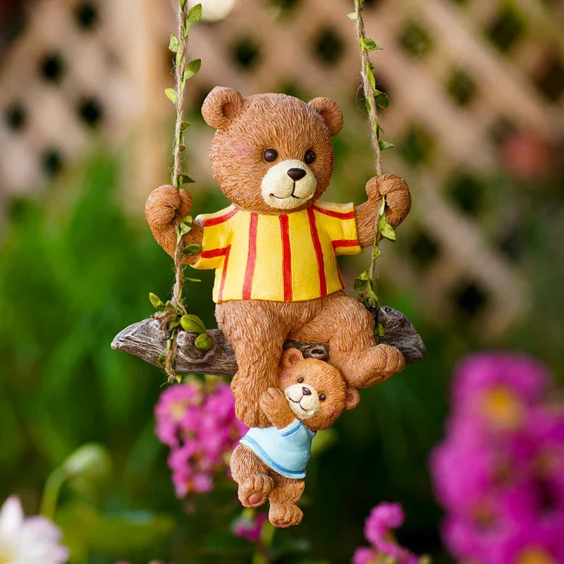 Charming resin ornament depicting a mother bear and her child on a swing, adding a touch of whimsy and warmth to any decor