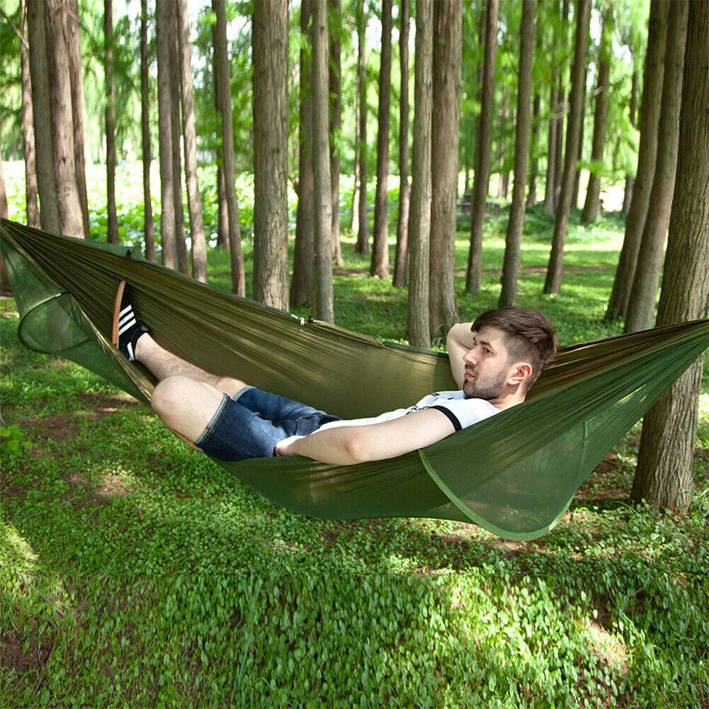 Premium portable camping hammock with integrated mosquito net in green, blue, and grey colours