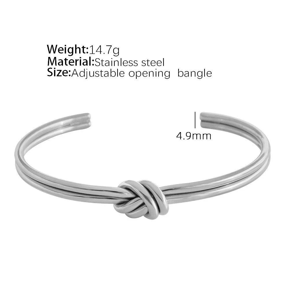 Stainless steel women's bracelet with knotted C-shape open double-layer design in gold or silver.