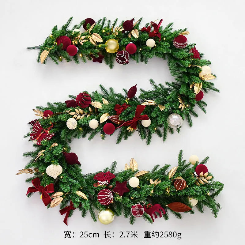 Long 2.7 metre Christmas PE rattan garland with velvet balls and integrated lights in golden leaf or red rattan colour.