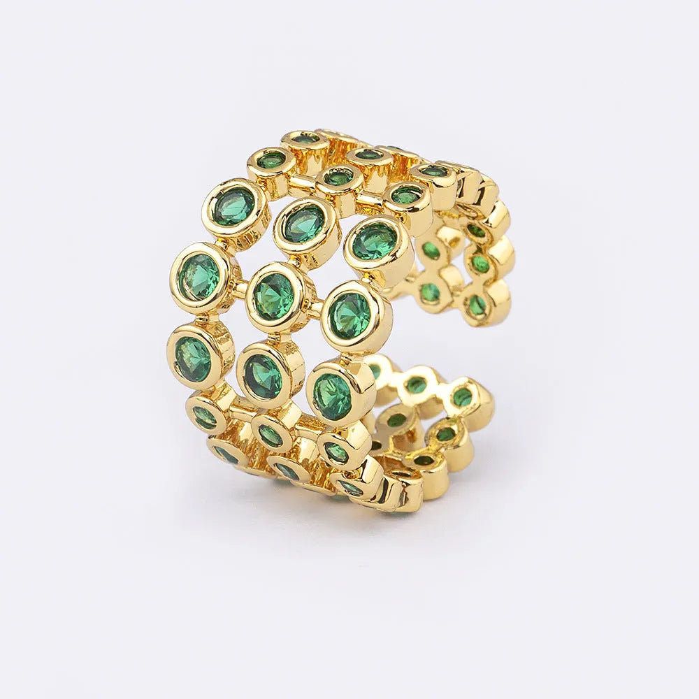 Wide gold-plated copper ring with three-layer design and a large green zircon stone.