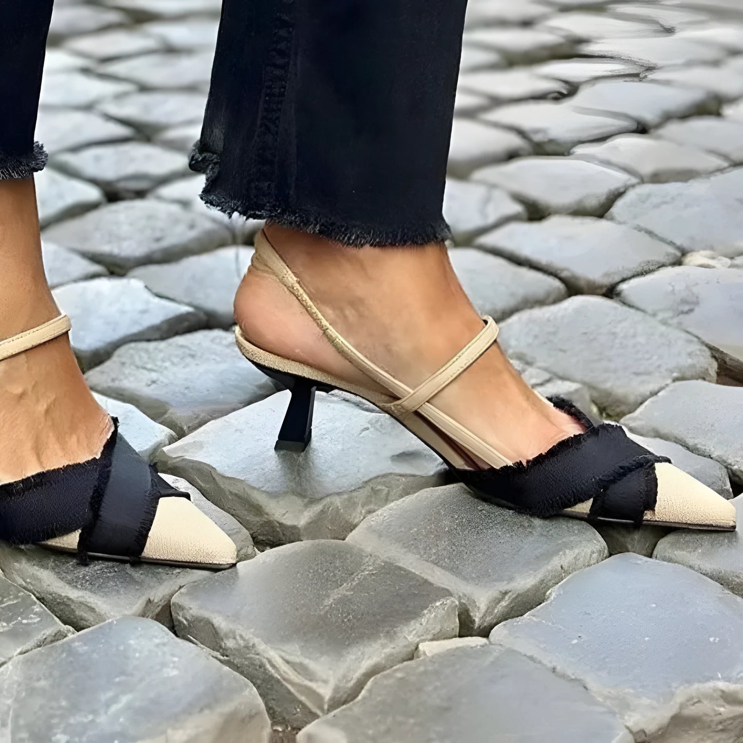 Women's apricot and black colour block pointed-toe sandals with a stiletto heel and an adjustable buckle fastening.