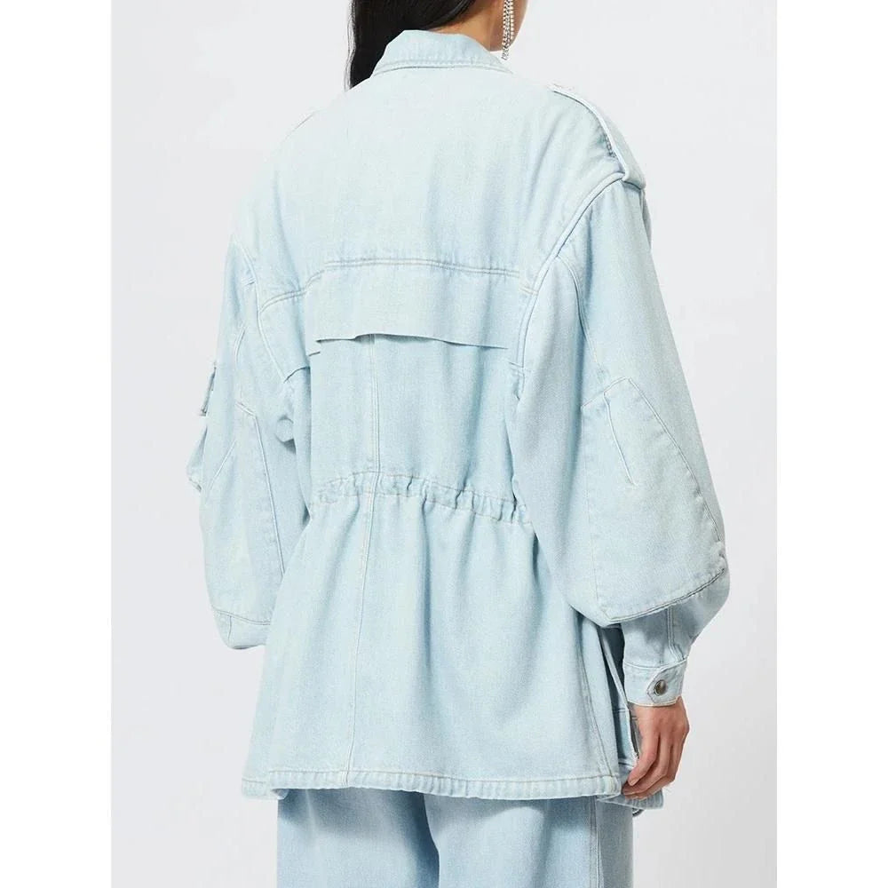 Chic patchwork denim jacket with practical pockets and button details, perfect for casual and semi-formal occasions.
