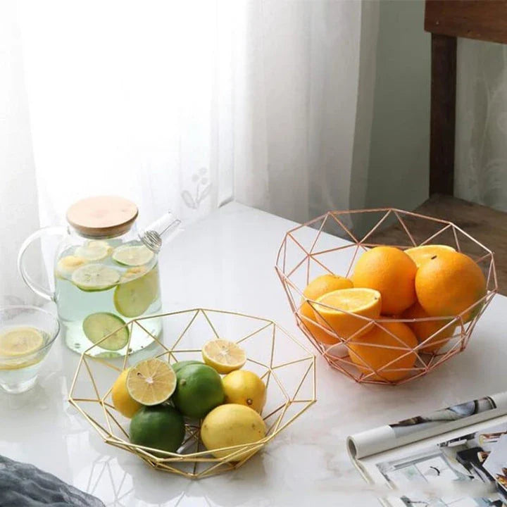 Wrought iron storage basket in black, gold, and rose gold colors, featuring a round, industrial-inspired design for versatile home organisation.