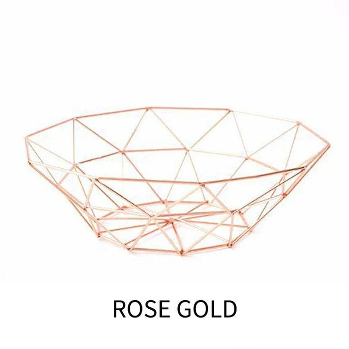 Wrought iron storage basket in black, gold, and rose gold colors, featuring a round, industrial-inspired design for versatile home organisation.