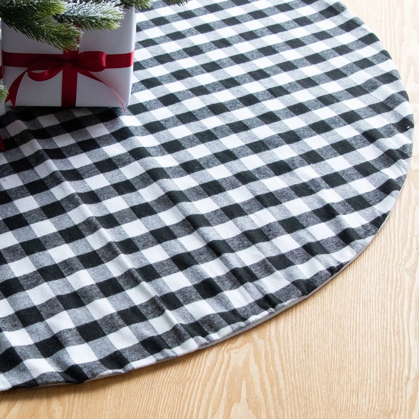 Black and white plaid Christmas tree skirt with a classic, elegant design