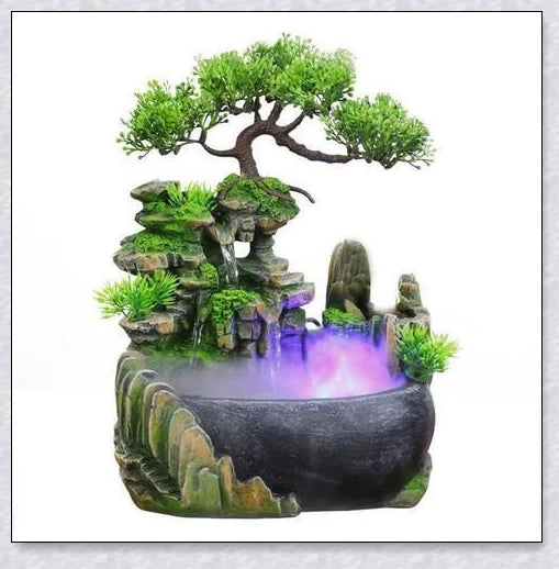 A beautiful resin tabletop fountain with flowing water, mimicking a river down a mountainside.