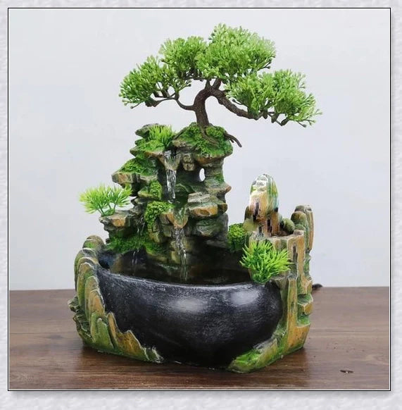 A beautiful resin tabletop fountain with flowing water, mimicking a river down a mountainside.