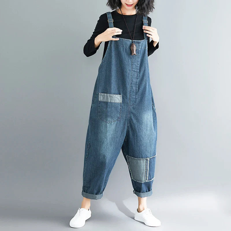 Casual literary women's plus size denim overalls with a high-waisted design and distressed accents for a stylish, comfortable look.