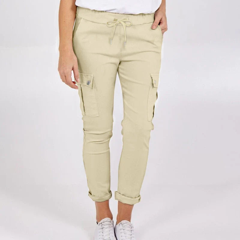 Women wearing casual cargo trousers with pockets in a solid colour and drawstring waist