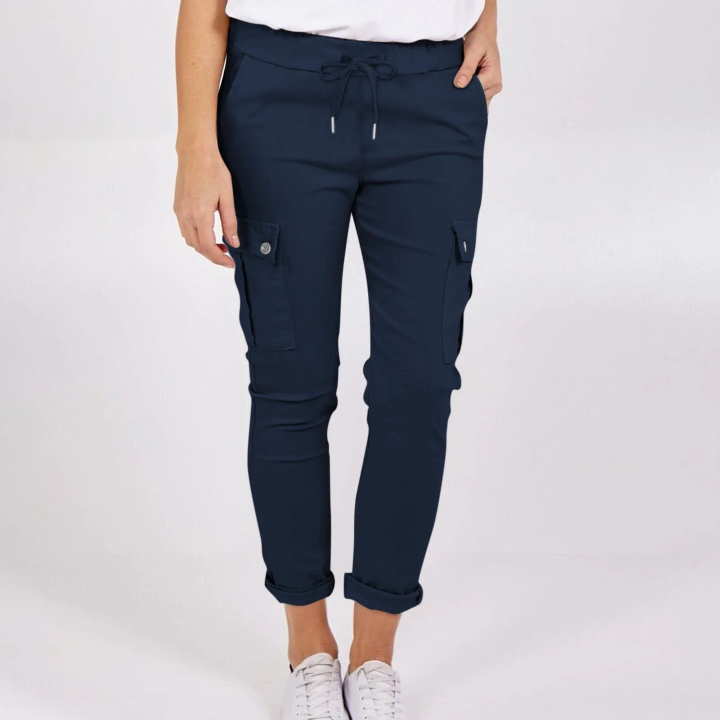 Women wearing casual cargo trousers with pockets in a solid colour and drawstring waist