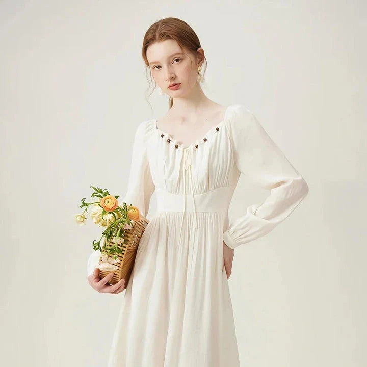 Elegant Chinese-inspired dress with a romantic, sophisticated design in creamy-white colour