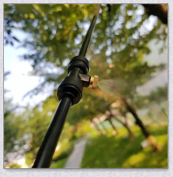 A high-quality outdoor misting system with adjustable nozzles, designed to cool and refresh your backyard or patio.