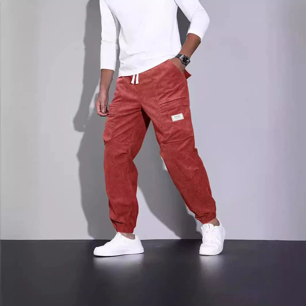 Men's corduroy overalls with ankle-tied loose fit and multi-pocket design, available in a range of autumnal colours
