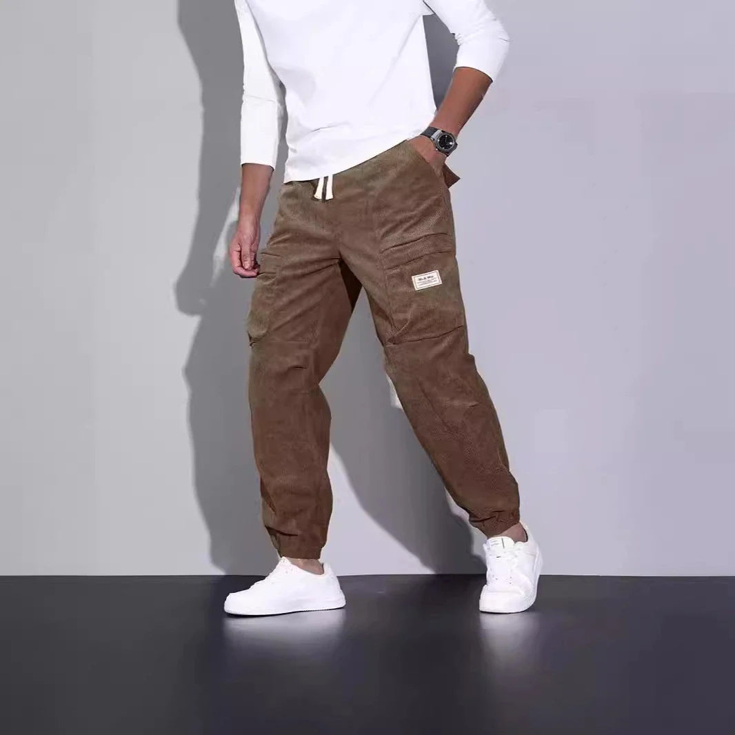 Men's corduroy overalls with ankle-tied loose fit and multi-pocket design, available in a range of autumnal colours
