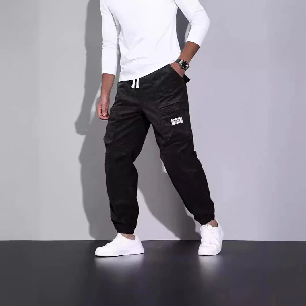 Men's corduroy overalls with ankle-tied loose fit and multi-pocket design, available in a range of autumnal colours