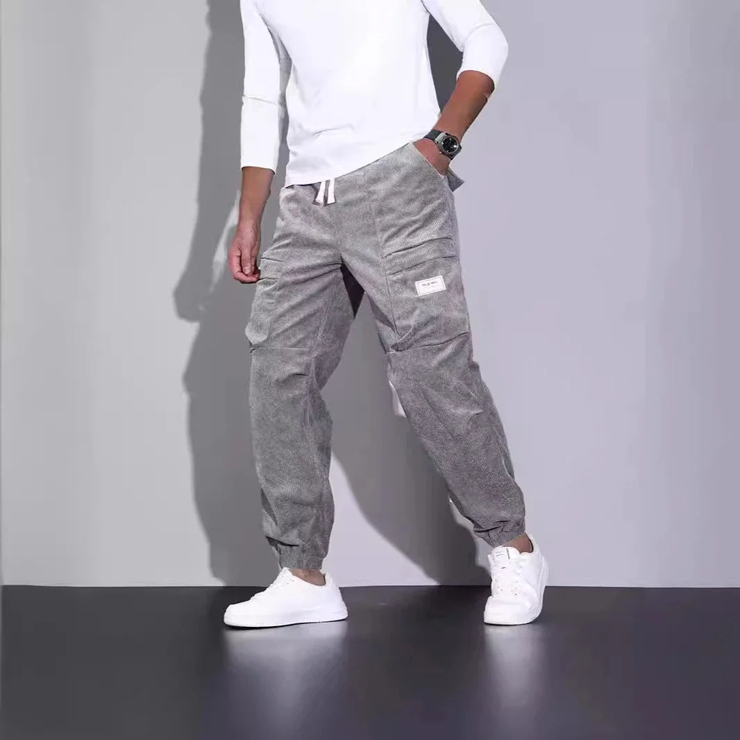 Men's corduroy overalls with ankle-tied loose fit and multi-pocket design, available in a range of autumnal colours