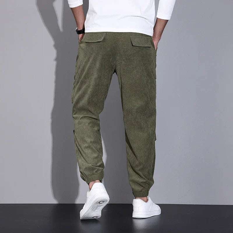 Men's corduroy overalls with ankle-tied loose fit and multi-pocket design, available in a range of autumnal colours