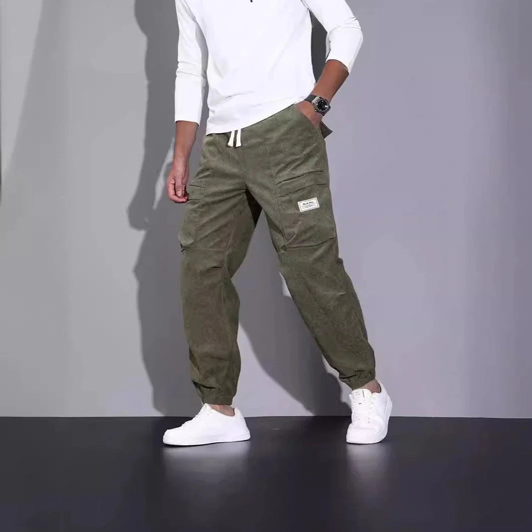 Men's corduroy overalls with ankle-tied loose fit and multi-pocket design, available in a range of autumnal colours