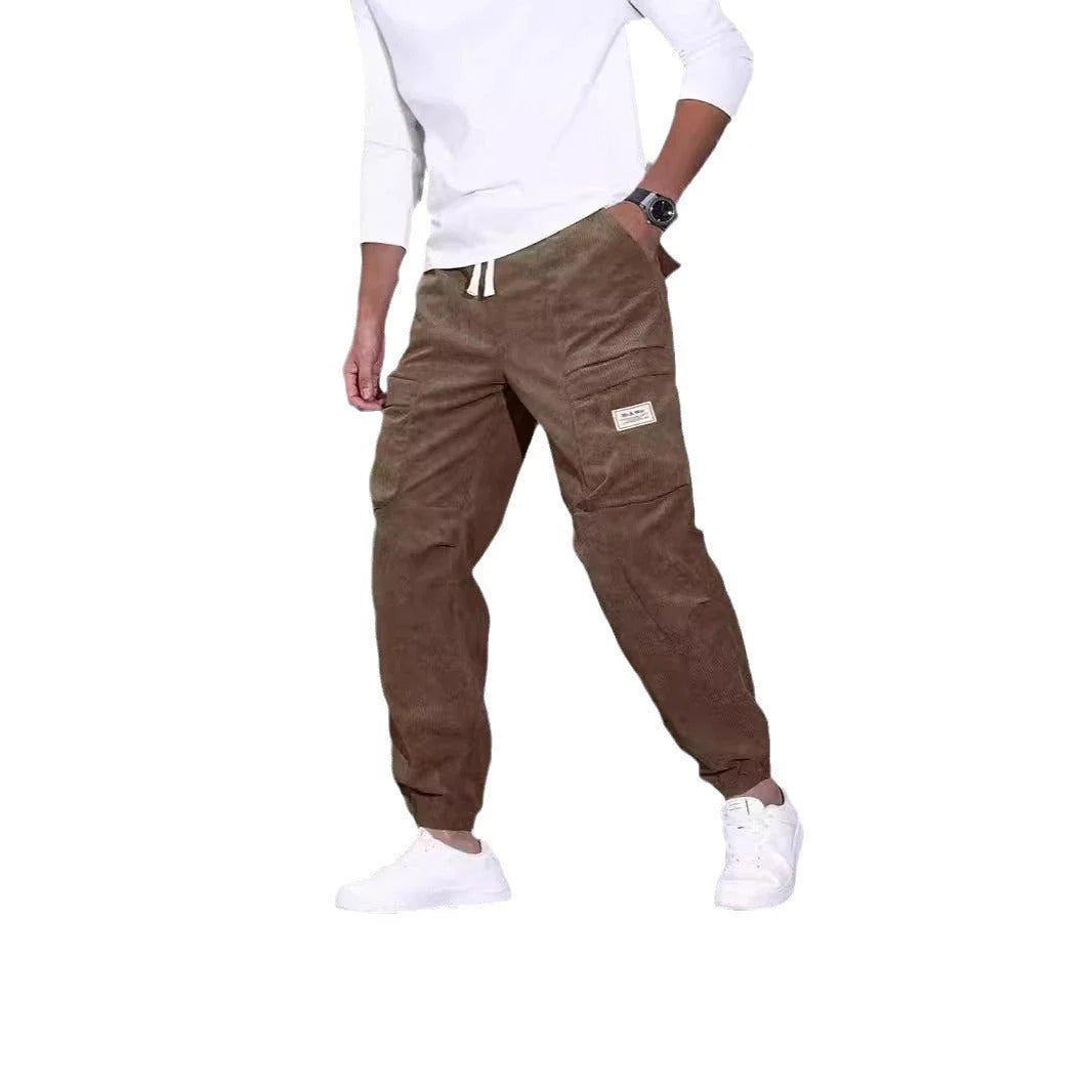 Men's corduroy overalls with ankle-tied loose fit and multi-pocket design, available in a range of autumnal colours