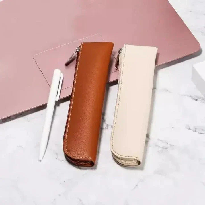 A sleek and sophisticated PU leather pencil case with a secure zipper closure, perfect for organising writing essentials for school and office use.