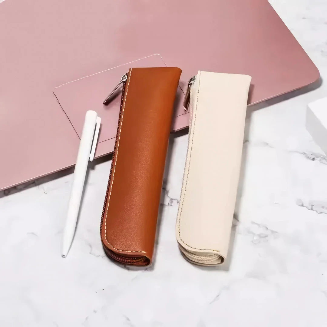 A sleek and sophisticated PU leather pencil case with a secure zipper closure, perfect for organising writing essentials for school and office use.