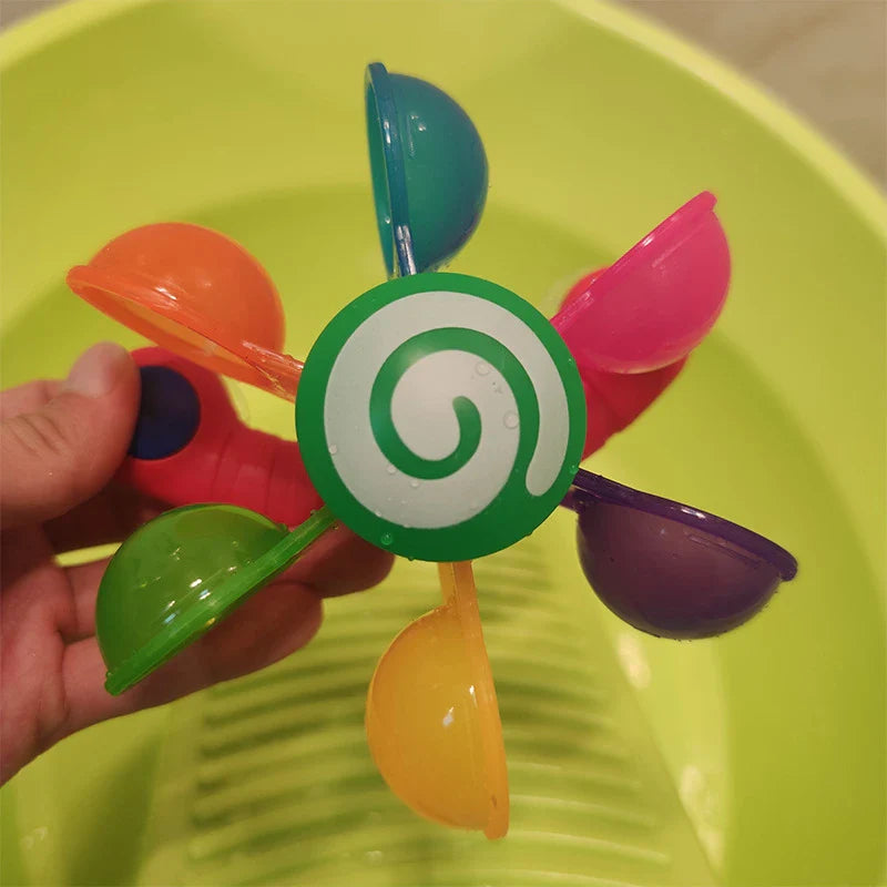 Colourful children's water wheel bath toy with spinning rainbow-coloured waterwheels