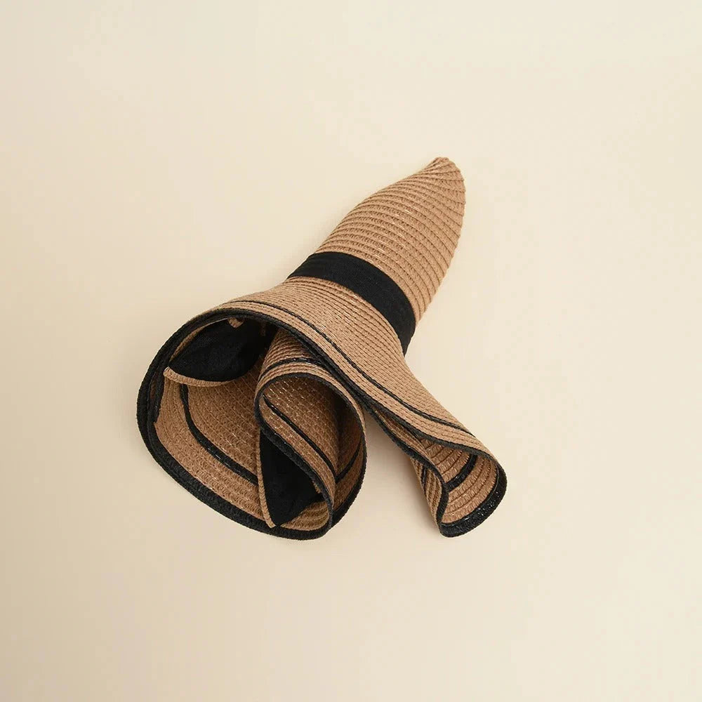 A stylish bowknot straw sun hat providing excellent UV protection and comfort for summer adventures