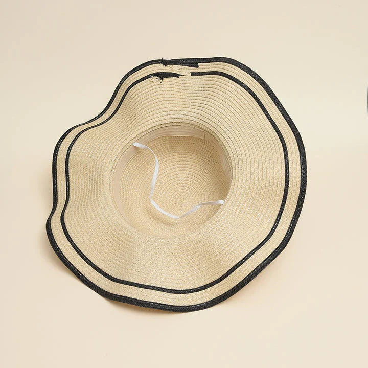 A stylish bowknot straw sun hat providing excellent UV protection and comfort for summer adventures