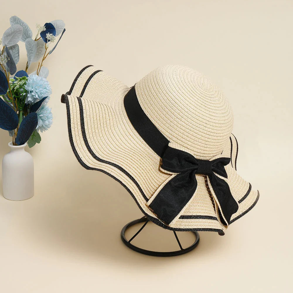 A stylish bowknot straw sun hat providing excellent UV protection and comfort for summer adventures