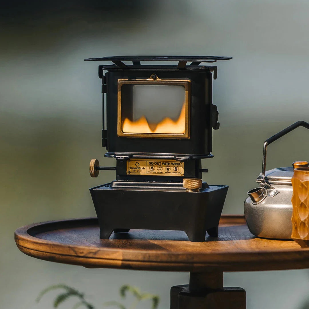 Portable retro oil lamp stove with a warm, flickering light for outdoor camping and picnics
