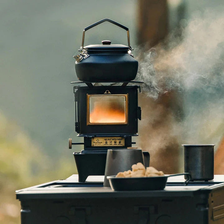 Portable retro oil lamp stove with a warm, flickering light for outdoor camping and picnics
