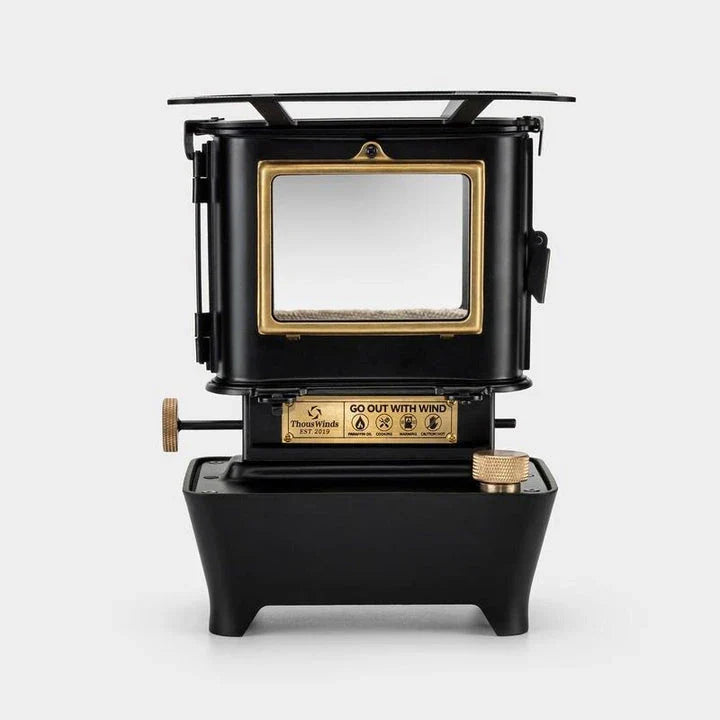 Portable retro oil lamp stove with a warm, flickering light for outdoor camping and picnics
