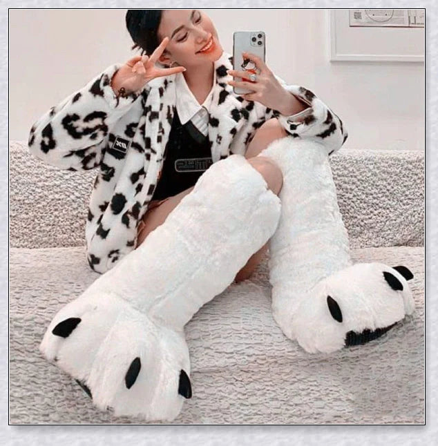 Oversized fluffy white bear claw winter slippers with a cosy and playful design, suitable for adults and kids alike