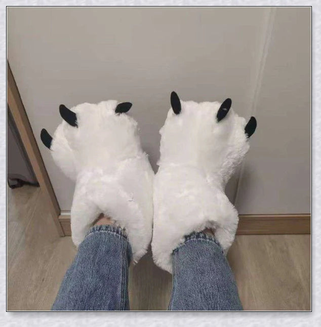 Oversized fluffy white bear claw winter slippers with a cosy and playful design, suitable for adults and kids alike