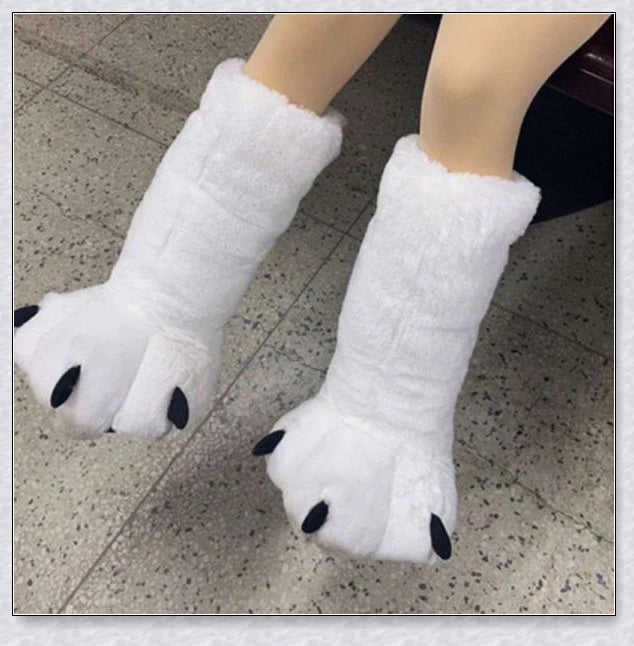 Oversized fluffy white bear claw winter slippers with a cosy and playful design, suitable for adults and kids alike