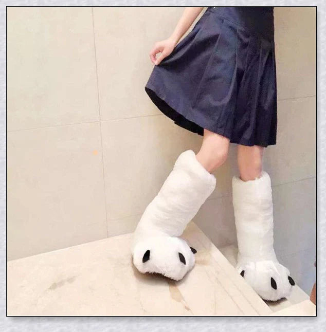 Oversized fluffy white bear claw winter slippers with a cosy and playful design, suitable for adults and kids alike