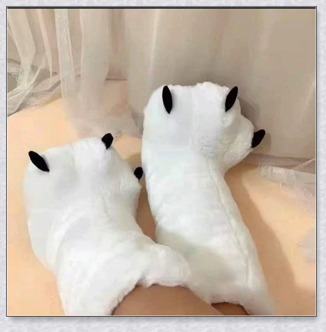 Oversized fluffy white bear claw winter slippers with a cosy and playful design, suitable for adults and kids alike