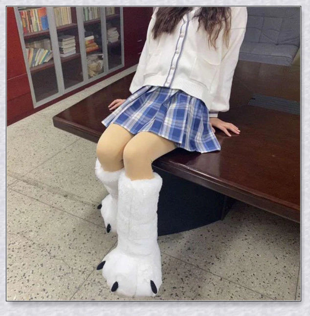 Oversized fluffy white bear claw winter slippers with a cosy and playful design, suitable for adults and kids alike