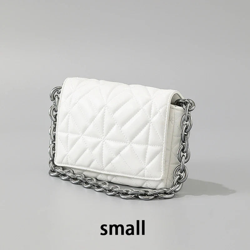 Lingge Small Bag in pink with a large gold chain, a stylish one-shoulder crossbody bag with a quilted design.