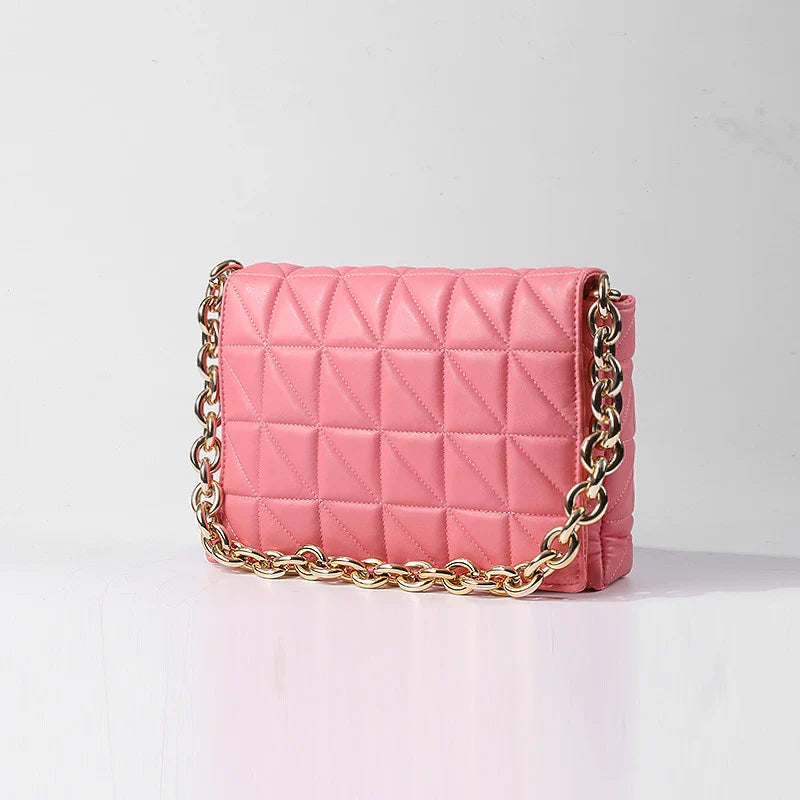 Lingge Small Bag in pink with a large gold chain, a stylish one-shoulder crossbody bag with a quilted design.