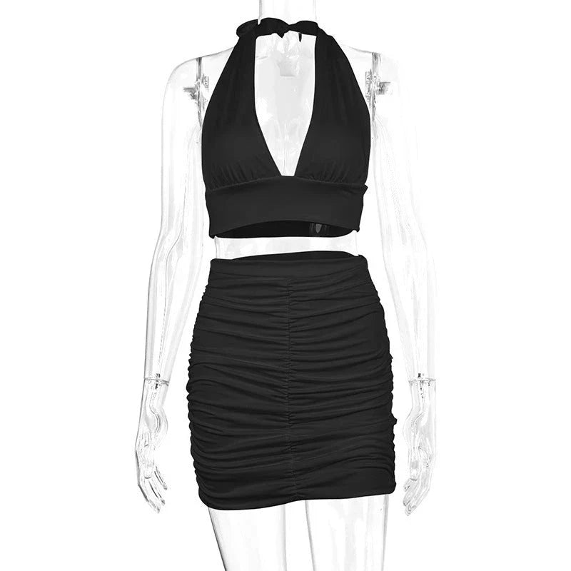 Elegant 2-piece dress suit featuring a halter lace-up top and pleated knee-length skirt in a variety of fashion colors