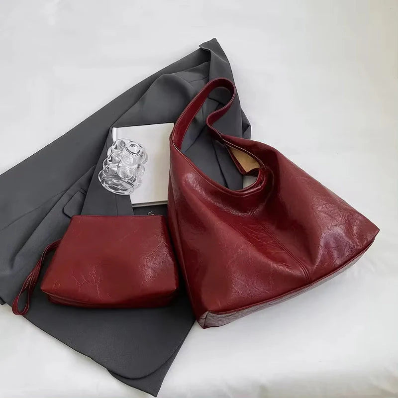 Classic vintage-inspired women's shoulder bag in a range of sophisticated colours, featuring a roomy interior, adjustable strap, and premium materials for timeless British style.