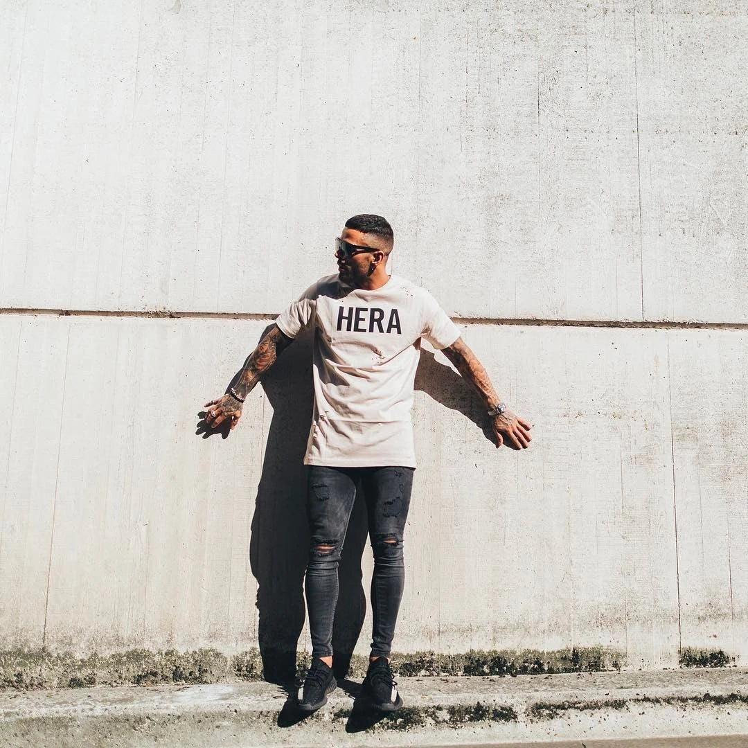 Trendy distressed black skinny jeans for men, featuring a super-elastic cotton construction and edgy, lived-in look