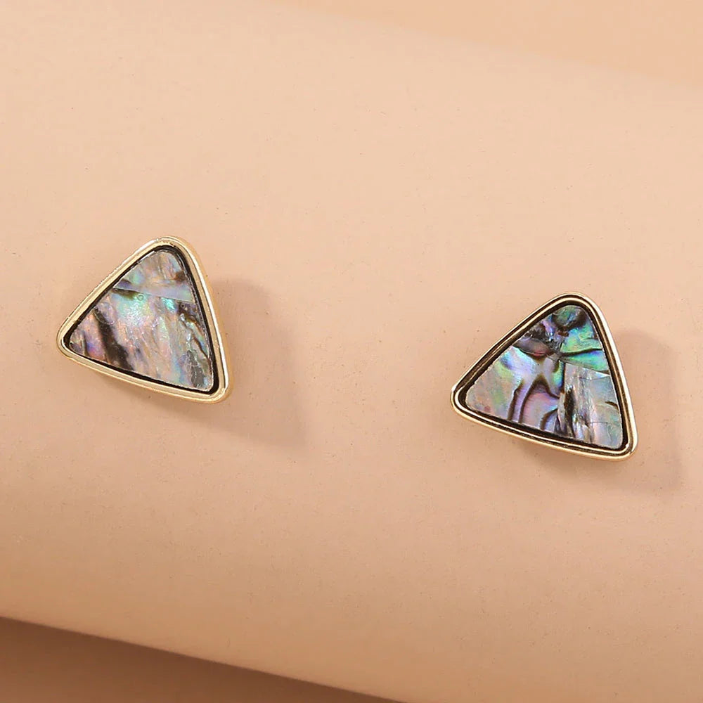 Triangular earrings with natural abalone shell set in a sleek zinc alloy frame
