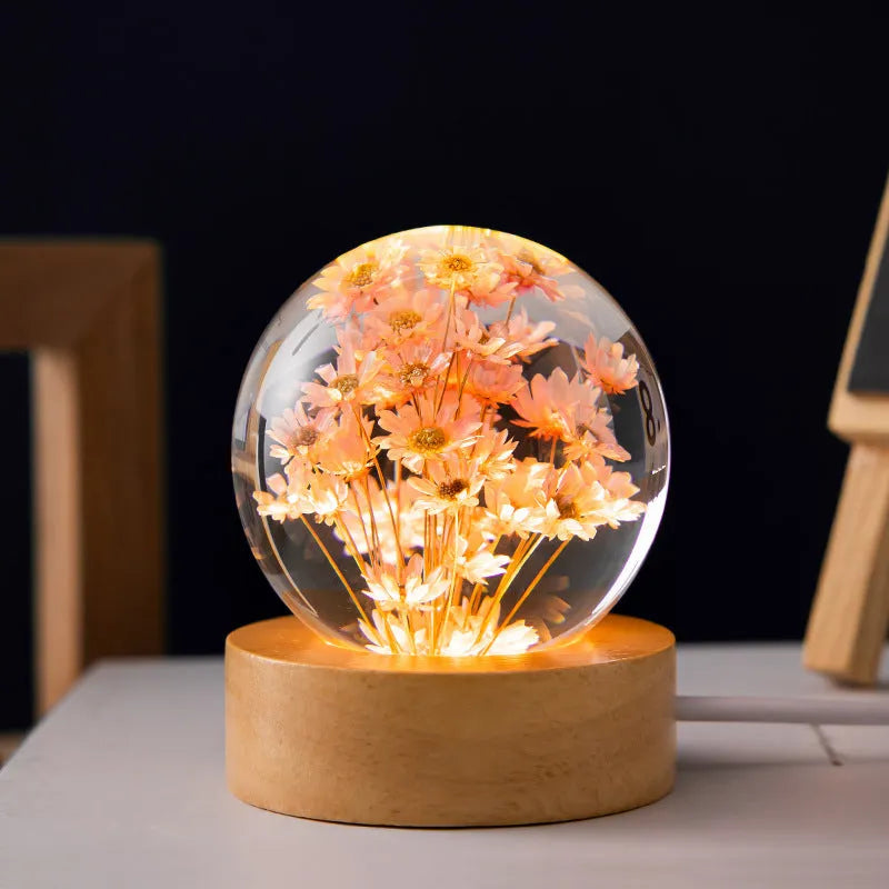USB-powered 3D dandelion crystal ball night light on a natural beech wood stand.